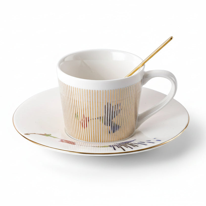 Ceramic cup with saucer and spoon on a white background, with measurements indicated.